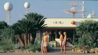 Three Surfers Waiting Beside A Faded Roadside · Variant 3 preview