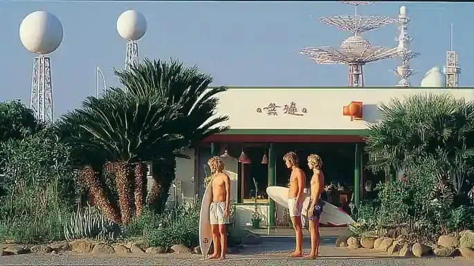 Three Surfers Waiting Beside A Faded Roadside · Variant 3 preview