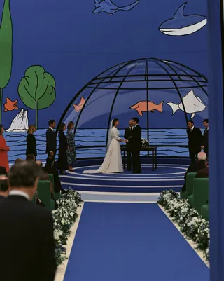 an elegant deep-sea wedding ceremony inside a transparent glass pavilion preview