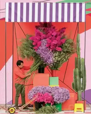 Night-Market Florist Building Enormous Bouquets Beneath Striped preview