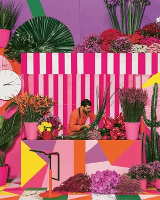 a night-market florist building enormous bouquets beneath striped awnings · Variant 4 preview